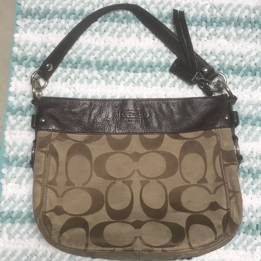 A Coach Purse in need of some clean up.